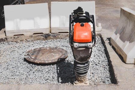 Close-up of a vibrating rammer on the roadの写真素材
