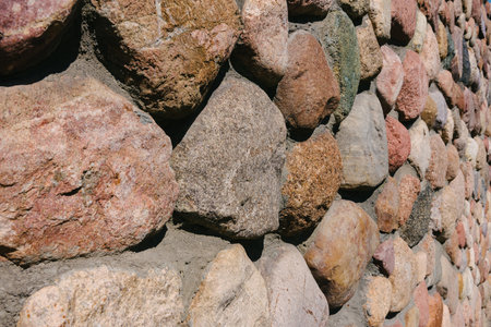 Close-up of the texture of a cobblestone made from mountain building stoneの写真素材