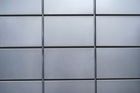 Close-up, texture of a metal panel of a modern building. Abstract backgrounds for designの写真素材