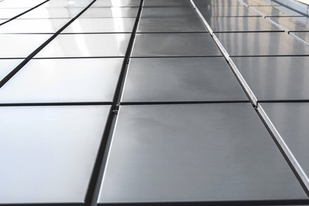 Close-up, texture of a metal panel of a modern building. Abstract backgrounds for designの写真素材