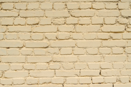 Closeup backgrounds texture of yellow beige painted retro brick wallの写真素材