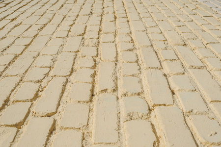 Closeup backgrounds texture of yellow beige painted retro brick wallの写真素材