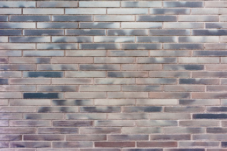 Close up backgrounds texture of red painted purple retro brick wallの写真素材