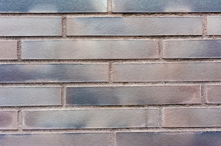 Close up backgrounds texture of red painted purple retro brick wallの写真素材