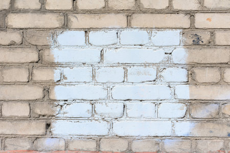 Painted rectangle patch on the wall. Painted rectangular censored graffiti on the wall, blank banner. Backgrounds and texture with empty surface for image or text, copy space.の写真素材