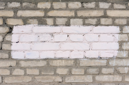 Painted rectangle patch on the wall. Painted rectangular censored graffiti on the wall, blank banner. Backgrounds and texture with empty surface for image or text, copy space.の写真素材