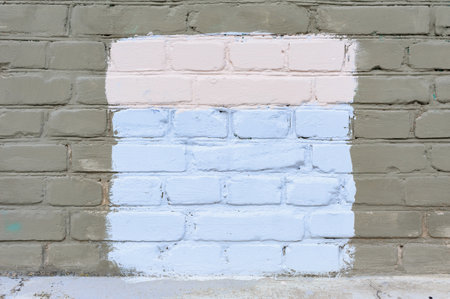Painted rectangle patch on the wall. Painted rectangular censored graffiti on the wall, blank banner. Backgrounds and texture with empty surface for image or text, copy space.の写真素材