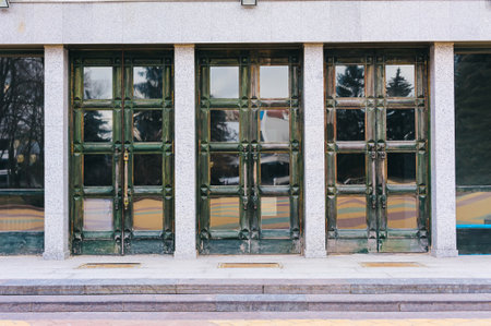 Three green old doors in a house backgroundの写真素材