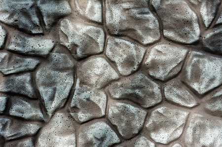 Close up of folded gray stone wall or fence backgroundの写真素材