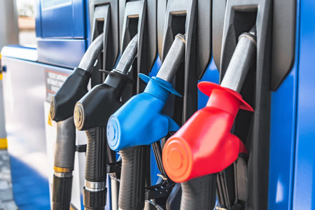 Close-up of fuel pistols at a gas stationの写真素材