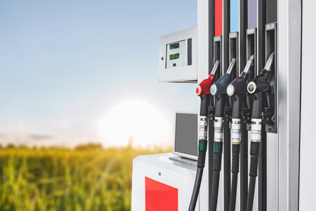 Close-up of a car eco-friendly gas station with fuel pistols. Nature background.の写真素材