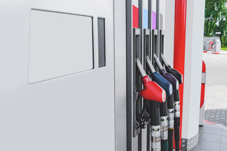Petrol station with colored guns and fuel hoses. Gasoline, diesel, eco hydrogen refueling column. Close-upの写真素材