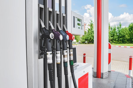 Close-up, Column with fuel guns in red, yellow and green. at a gas stationの写真素材