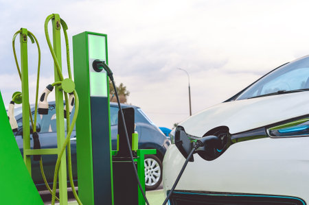 Close-up, power supply for the station, charging electric vehicles. On the background of the carの写真素材