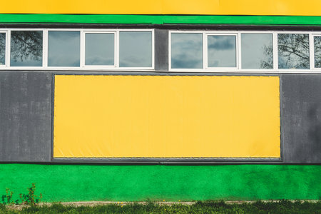 Mockup of an empty billboard banner on a buildingの写真素材