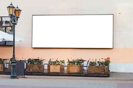 Blank screen mockup on building wall city advertisementの写真素材