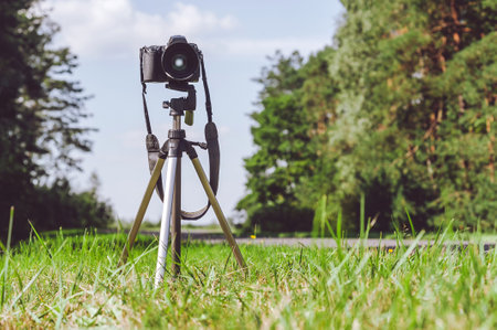 The camera is on a tripod. Beautiful nature background with blue skyの写真素材