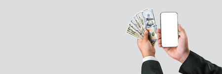 Banner, Smartphone mockup with American money in the hands of a businessman. on a light gray backgroundの写真素材