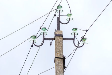 Closeup Street pole with wires. against the background of the sky