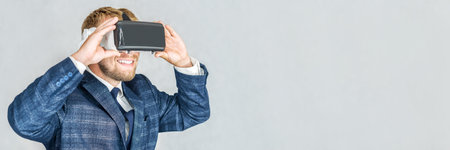 Banner, Happy Business man wearing virtual reality glasses.on a light background