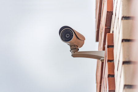 Close-up, CCTV camera on a multi-storey buildingの写真素材