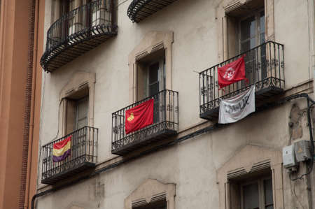 Balconies with flags in the city of Huesca.の写真素材