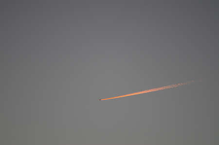 Plane at sunset flying over Gran Canaria. Canary Islands. Spain.