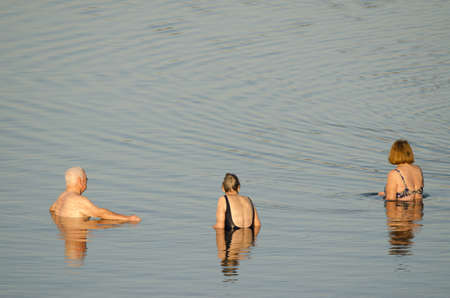 Older people bathing in the sea. Playa de Arinaga. Aguimes. Gran Canaria. Canary Islands. Spain.の写真素材