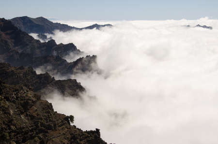 Rocky cliffs and sea of clouds. Caldera de Taburiente National Park. La Palma. Canary Islands....