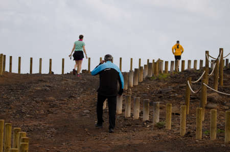 El Confital, February 27, 2022: People walking and running. La Isleta. Las Palmas de Gran Canaria. Gran Canaria. Canary Islands. Spain.のeditorial素材