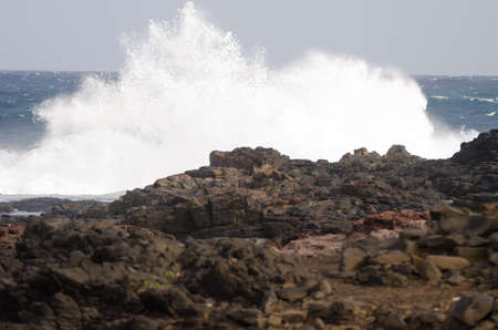 Wave breaking against the shore. El Confital. La Isleta Protected Landscape. Las Palmas de Gran...