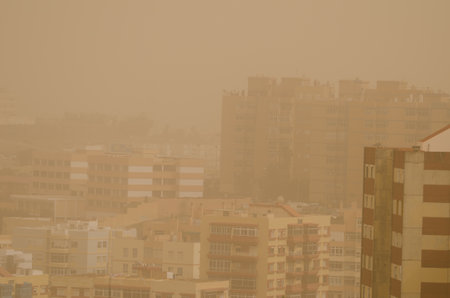Buildings in Las Palmas de Gran Canaria under a dense haze formed by airborne dust. Gran Canaria. Canary Islands. Spain.の写真素材