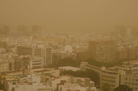 City of Las Palmas de Gran Canaria under a dense haze formed by airborne dust. Gran Canaria. Canary Islands. Spain.の写真素材