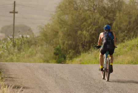 Cyclist on a dirt road. San Lorenzo. Las Palmas de Gran Canaria. Gran Canaria. Canary Islands. Spain.の写真素材