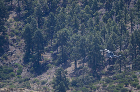 Helicopter with two people descending on a cable. Integral Natural Reserve of Inagua. Tejeda. Gran...