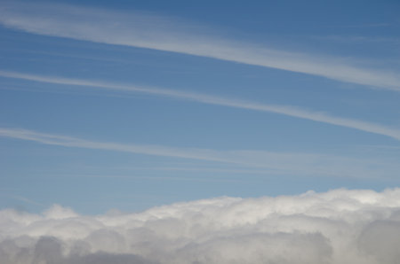 Aircraft vapor trails and sea of clouds. Gran Canaria. Canary Islands. Spain.