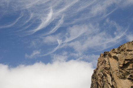 Rocky cliff and cloudscape. The Nublo Rural Park. Tejeda. Gran Canaria. Canary Islands. Spain.の写真素材