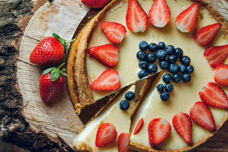 Classic cheesecake New York with strawberry and blueberry on topの写真素材