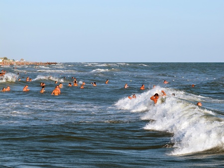 people having fun and recreation at a black sea beach