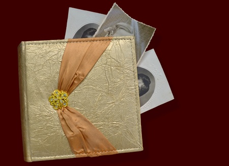 a photo-album with some old photosの写真素材