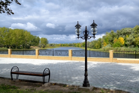 a stone tiled walkway quay at Dnieper river bank in the vicinity of Kherson in Southern part of Ukraineの写真素材
