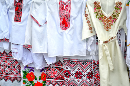 traditional national Ukrainian handiwork embroidered and decorated shirts, dresses and towels  popular nowadays in Ukraine as manifestation of national authentication and as just a modish styleの写真素材