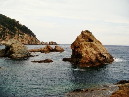 Rocks in the Mediterranean sea in Tossa de Mar, Costa Brava, Spain as a stunning landscapeの写真素材