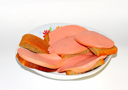 sausage sandwiches on a plate, on white backgroundの写真素材