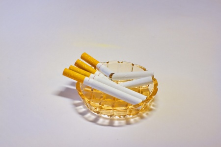 cigarettes, ashtray, on white background. do not smokeの写真素材