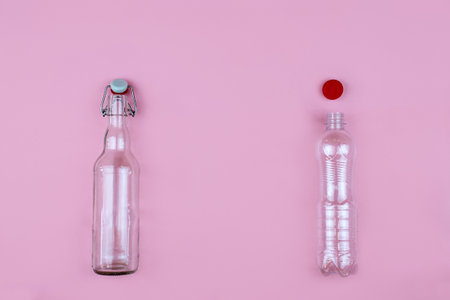 Plastic and glass bottle on a pink background. Plastic free, zero weste concept.の写真素材