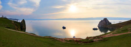 Sunset on Lake Baikal, Olkhon Island in summer. Panoramic view of the Khuzhir Bai and the Burhan chain, Shamanka.の写真素材