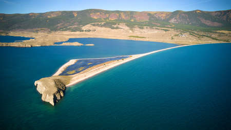Lake Baikal from the air. View of the bay near the village of Kurma in summer, Cape Uyuga. High quality photoの写真素材