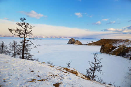 View of Cape Burhan or Shamanka rock on Olkhon island in winter. Frozen Lake Baikal.の写真素材