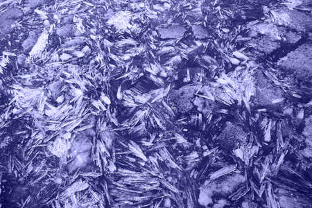 Texture of water and ice surface in trendy violet color. Winter natural background.